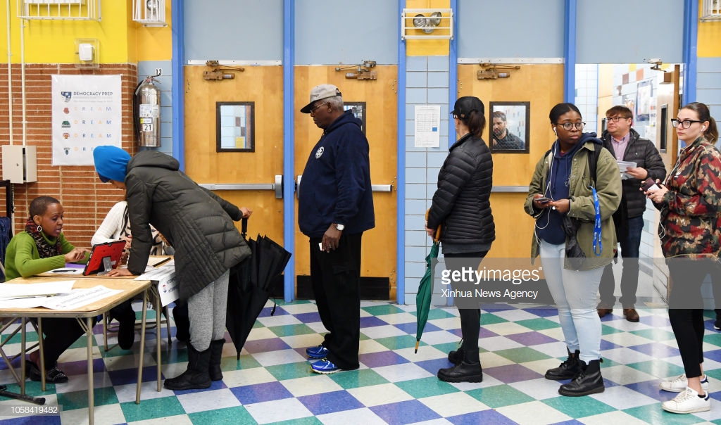 Voters register at a polling station in Manhattan of New York, the United States, on Nov. 6, 2018. Getty Images/Xinhua/Li Rui